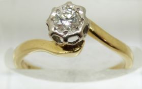 An 18ct gold ring set with a diamond of approximately 0.2ct in a platinum setting, 2.7g, size J