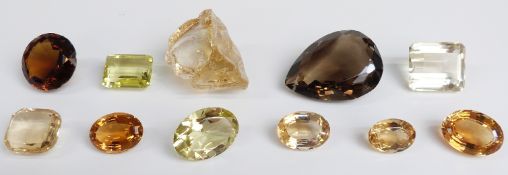 Five oval cut citrine, emerald cut citrine, cushion cut citrine, a round cut smoky quartz, an oval