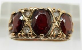 A 9ct gold ring set with garnets, 3.7g, size K