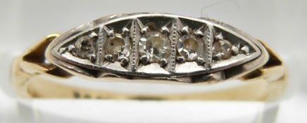 An 18ct gold ring set with five diamonds in a boat shaped platinum setting, 2.5g, size M