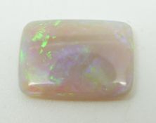 A rectangular opal cabochon, 10 x 14.1 x 2.3mm