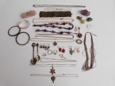 A collection of silver jewellery including pendants, amethyst items, bracelets, pearl necklace,