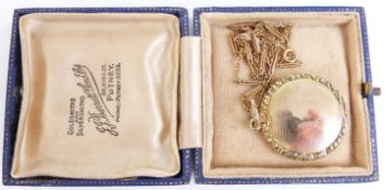A 9ct gold necklace and Victorian locket with engine turned decoration and textured border, 2.5cm