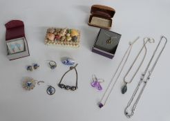 A collection of silver jewellery including labradorite necklace, amethyst necklace, necklace set