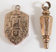 Victorian locket with buckle decoration and engraved decoration and a Victorian watch key