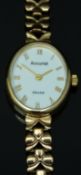 Accurist 9ct gold ladies wristwatch with gold hands and Roman numerals, white enamel dial and quartz