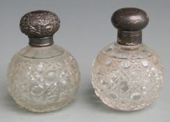 Two hallmarked silver lidded hobnail cut globe shaped dressing table scent or similar bottles, one