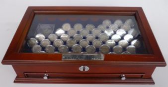 A collection of UK shillings in glass topped collector's case around 50 in all including some pre-