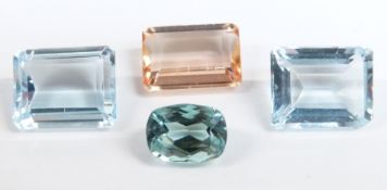 Two emerald cut aquamarines measuring approximately 1.8ct each, a cushion cut aquamarine measuring