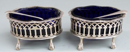 Pair of Victorian hallmarked silver salts with pierced decoration and blue glass liners and rasied