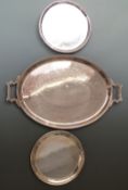 Large twin-handled plated tray, length 65cm, circular salver raised on three feet and a plain
