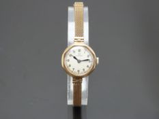 Omega 9ct gold ladies wristwatch ref. 611.622 with blued hands, black Arabic numerals, silver