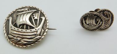 A hallmarked silver Scottish brooch depicting a Viking ship by Robert Allison with matching