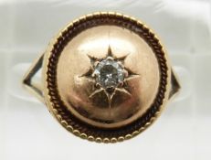 A 15ct/9ct gold ring set with a diamond in a star setting, 3.8g, size L