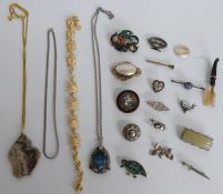 A collection of jewellery including Victorian silver brooches, Victorian brooch set with mother of