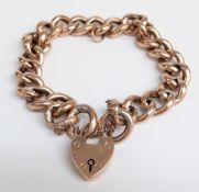 A 9ct rose gold curb link bracelet with heart padlock, 30.6g