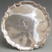 Modern hallmarked silver salver with shaped edge, raised on four scolling feet, London 1967 maker
