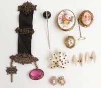 A collection of jewellery including two Victorian cameos, a mother of pearl brooch set with cut