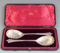 Victorian cased pair of hallmarked silver serving spoons with shell bowls, London 1895 maker