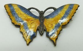 A silver brooch set with blue and yellow enamel in the form of a butterfly, 5 x 2.5cm