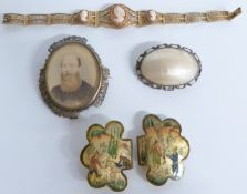 A filigree bracelet set with cameos, a mother of pearl buckle, mother of pearl brooch and a portrait