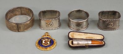 Victorian hallmarked silver napkin rings, two being a pair marked with the initial D, retro style