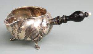 Danish white metal jug with handle to side, raised on three feet, rubbed Danish silver marks to