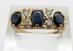 A 9ct gold ring set with three oval sapphires and diamonds, 3.5g, size R