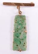 An 18ct gold brooch set with a jadeite plaque, 3.5cm long