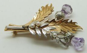 9ct gold bi-coloured brooch set with purple paste and seed pearls in the form of a thistle and fern,