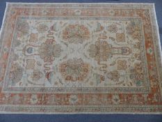 Beige ground rug with pink and blue decoration, 294 x 204cm