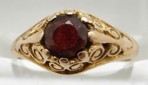 A 9ct gold ring set with a garnet, 2.1g, size J