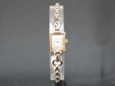 Rotary 9ct gold ladies wristwatch with gold hands and hour markers, silver dial and signed 15