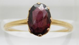 Victorian 9ct gold ring set with an oval cut almandine garnet, in original Piccadilly Circus box,