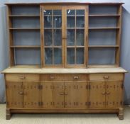 Early 20thC Cotswold School Arts & Crafts studded oak dresser with central two door glazed cabinet