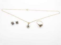 A suite of 9ct gold jewellery set with sapphires and diamonds comprising ring, earrings, and