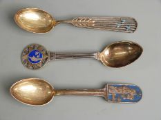 Three Danish white metal and enamel spoons, one 1931 maker Christian F Heise, another 1934 maker