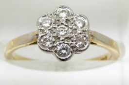 An 18ct gold ring set with diamonds in a platinum cluster, 2.8g, size L