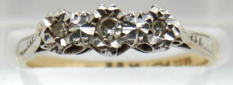 An 18ct gold ring set with diamonds in a platinum setting, 2.1g, size M