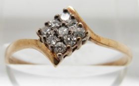 A 9ct gold ring set with diamonds, 1.3g, size Q