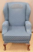 Upholstered floral wing back armchair, H100 x W66 x D92cm
