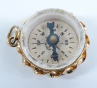 A 9ct gold compass charm, 2.7g