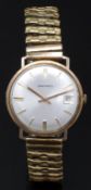Garrard 9ct gold gentleman's wristwatch with date aperture, gold hands and baton markers, silver