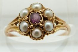 Victorian ring set with a garnet surrounded by seed pearls, 1.9g size O