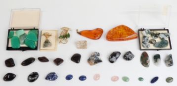 Forty various polished mineral samples and gemstones including amber, agate, quartz etc, some set in
