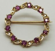 A 9ct gold brooch/ pendant set with rubies and diamonds, 2.1g