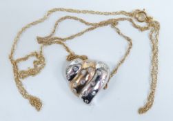 A 9ct gold bi-coloured pendant set with diamonds, 3.8g