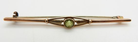 A 9ct gold brooch set with a round cut peridot