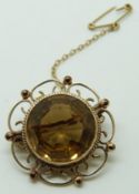 Victorian 9ct gold brooch set with a round cut citrine