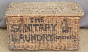 Vintage wicker laundry basket marked 'The Sanitary Laundry (Hereford) Ltd'